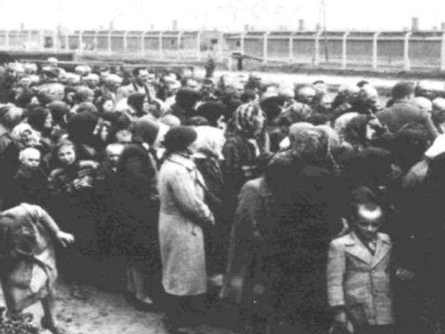 Jewish women and children waiting for a selection at the ramp in Birkenau. This is where the Nazis decided if prisoners lived or died.