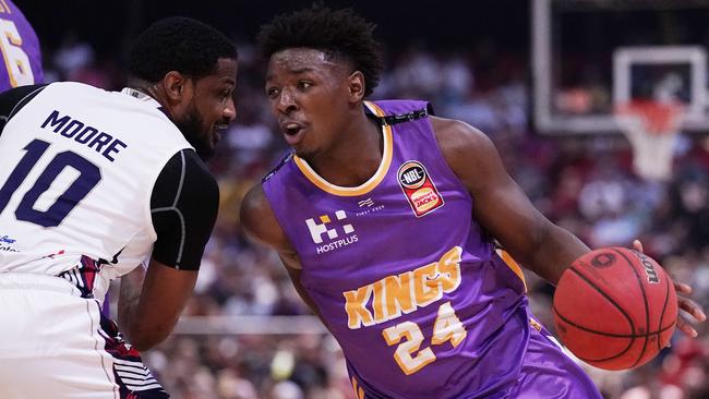 The Kings’ Jae'Sean Tate takes on the 36ers Ramone Moore on Saturday night. Picture: Getty Images