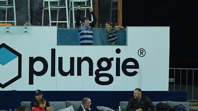 The Cats lost, but that didn’t stop these fans taking the plunge. Picture: AFL Photos/Getty Images