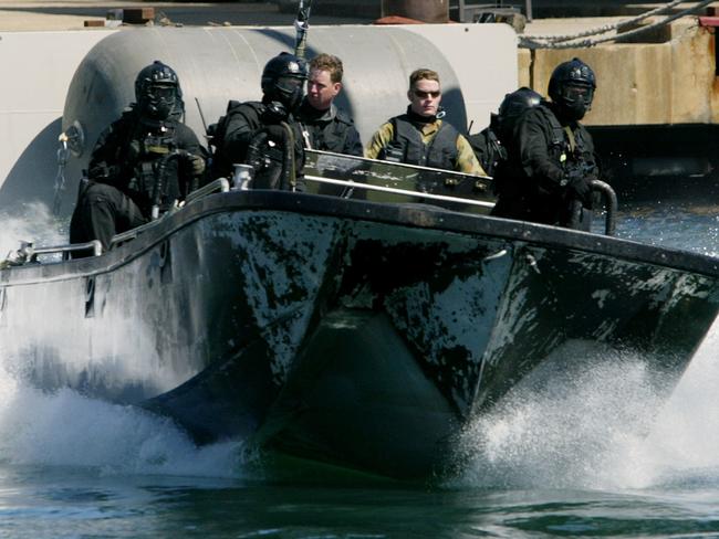 A speedboat races into Garden Island Naval Base on Sydney Harbour during a counter-terrorism exercise in September 2003. Picture: Supplied