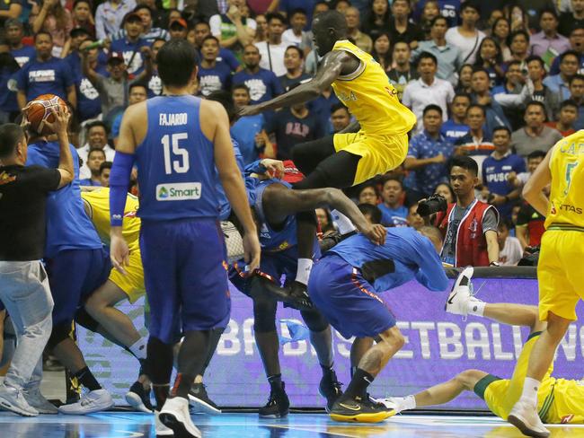 Thon Maker flies in to protect his mates. Picture: AP