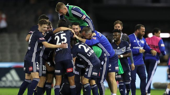Melbourne Victory players swamp Andrew Nabbout after his injury-time winner against Adelaide United last week. Picture: AAP