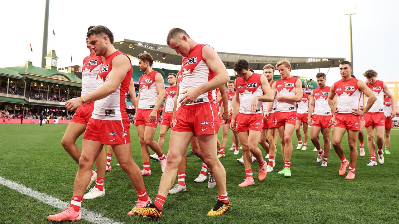 The Swans walk from the field after the rare defeat. (Photo by Matt King/AFL Photos/via Getty Images)