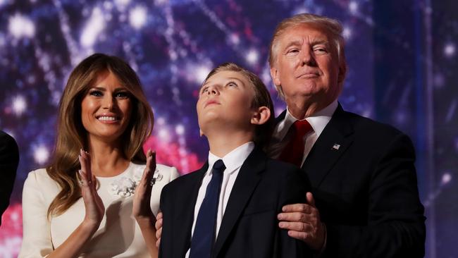 Donald Trump embraces his son Barron Trump, as his wife Melania Trump. Picture: Chip Somodevilla/Getty Images