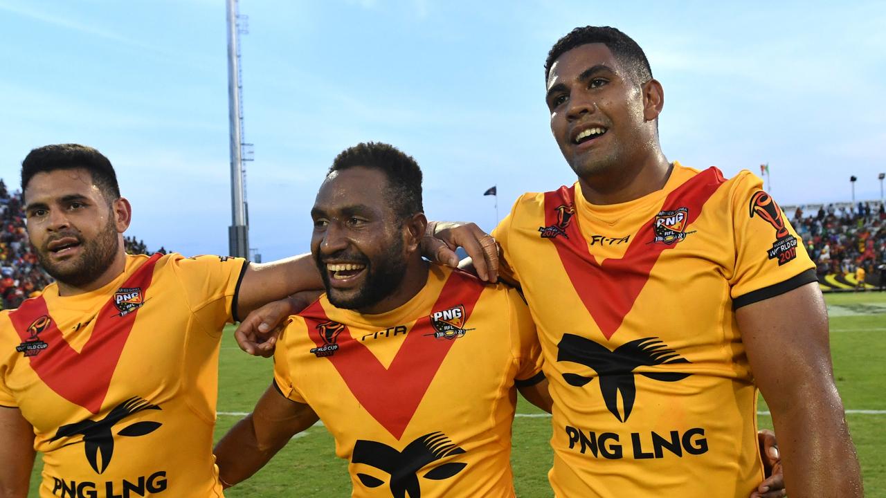 Papua New Guinea's Rhys Martin, Justin Olam and Nene Macdonald after beating Ireland in the 2017 World Cup