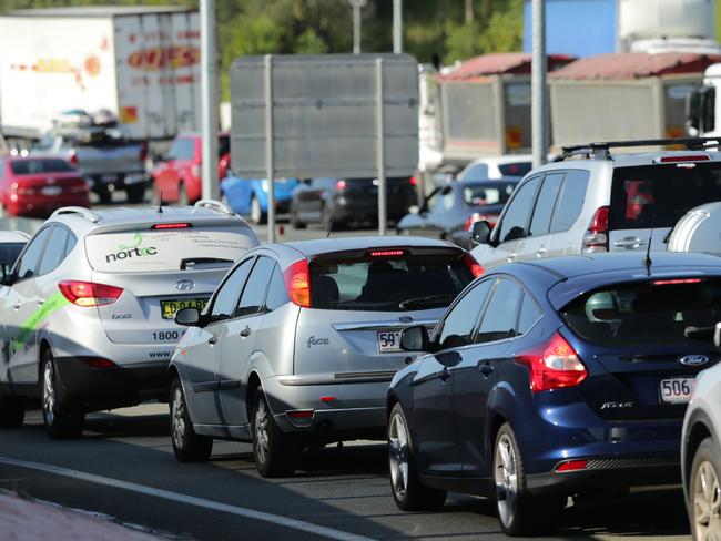 Malcolm Turnbull says his funding for the M1 would ultimately mean Queenslanders could spend more time with their families. Picture: Luke Marsden