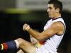 AFL Round 14 Essendon v Adelaide AT Etihad Stadium. Taylor Walker kicks at goal. Pic: Michael Klein. Saturday June 21, 2014.