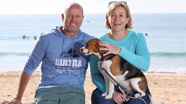 Zali Steggall pictured with her husband Tim Irving and their dog Charli at Manly Beach after Zali won the seat of Warringah last night, in the Federal election, Manly. Picture: Damian Shaw