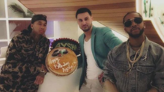 A snap from Salim’s Facebook page of US rappers T<a href="http://www.news.com.au/entertainment/music/former-auburn-deputy-mayor-salim-mehajer-posts-picture-on-facebook-of-himself-and-us-musicians-tyga-and-omarion-posing-with-a-cake/news-story/97e4e0497b93f387c7b506cea458099b" target="_blank">yga and Omarion</a> at wife Aysha’s birthday. But where was Aysha?