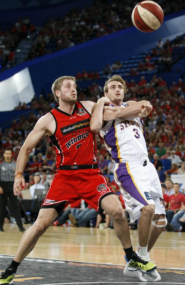 Callum Jenkins (right) playing for the Kings against the Wildcats at Perth Arena.