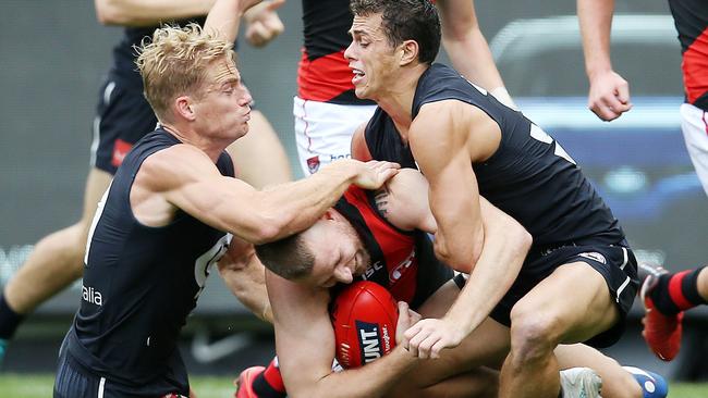 Sam Kerridge and Ed Curnow make sure Jake Stringer isn’t going anywhere. Picture: Michael Klein