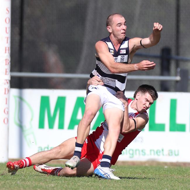 South Bendigo’s Jake Rusbridge lays a tackle on Strathfieldsaye’s Harry Welch.