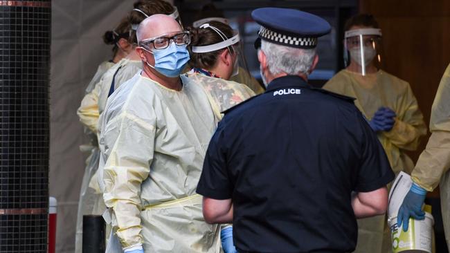 Medical staff and police prepare to test returned overseas travellers for Covid-19 at Peppers Hotel in Waymouth St, in November 2020. Photo: Brenton Edwards