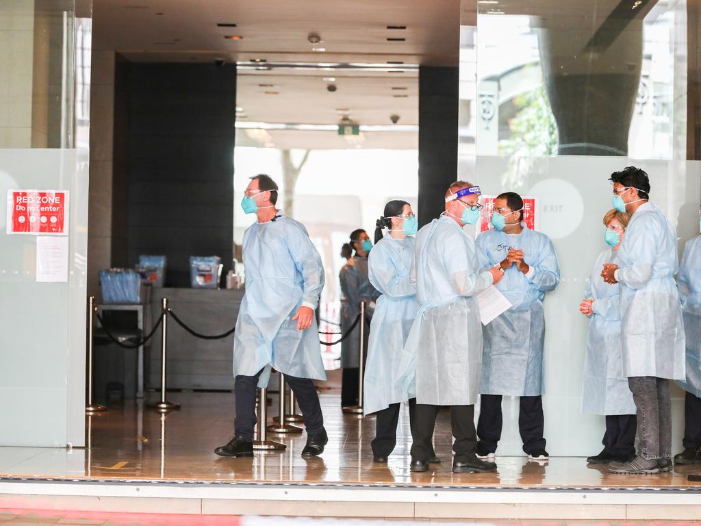 Hotel quarantine workers wearing full PPE in Australia. Picture: Asanka Ratnayake/Getty Images