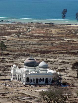 (FILES) This aerial file photo taken on January 16, 2005 shows a partly damaged mosque in the Lampuuk coastal district of Banda Aceh on Indonesia's Sumatra island, an area which was devastated in the earthquake and tsunami on December 26, 2004. Indonesia will mark on December 26, 2014 the 10th year anniversary of the deadly tsunami which killed more than 170,000 people in Aceh, and tens of thousands of others in other countries around the Indian Ocean. AFP PHOTO / FILES / JOEL SAGET