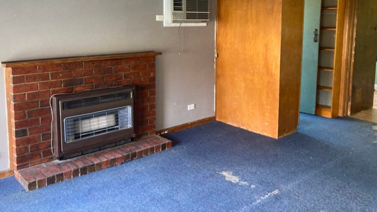 Ripped carpet in the living room.