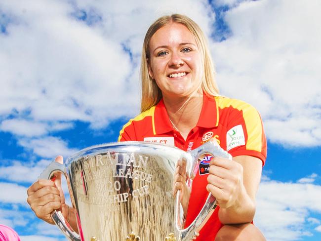 Start of the AFL Premiership Cup tour of QLD. AFLW Gold Coast draftee Annise Bradfield, 17 with nippers Leroy Kaesler and Jordan Kaesler from Kurrawa Surf Club.Picture: NIGEL HALLETT