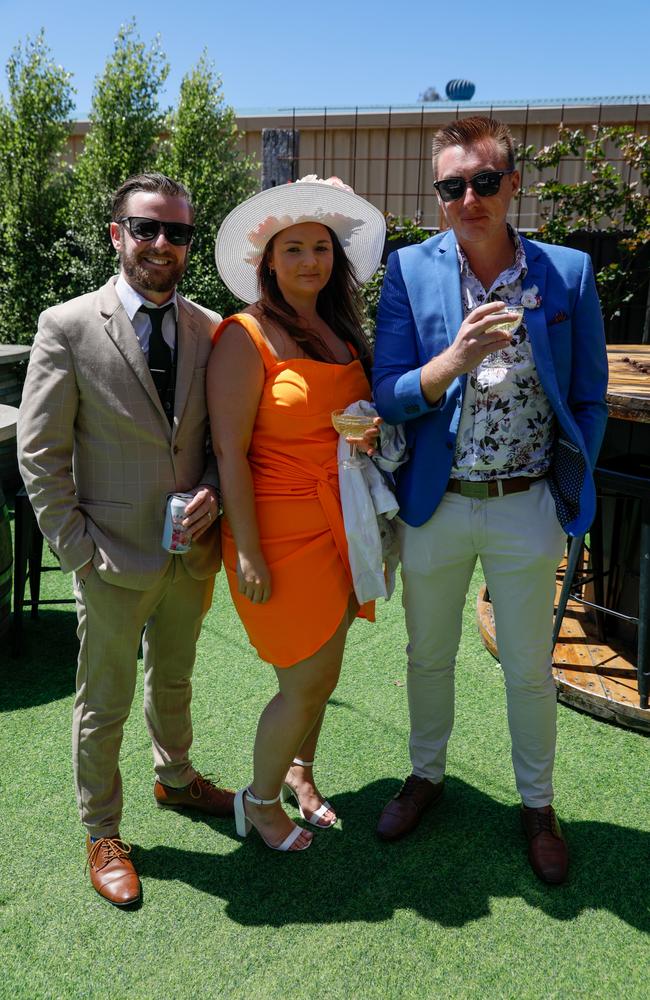 Jordan Case, left, with Maddi and Michael Parmenter from Huskisson at Flamin Galah Brewery in Huskisson for Melbourne Cup Day. Picture: Nathan Schmidt