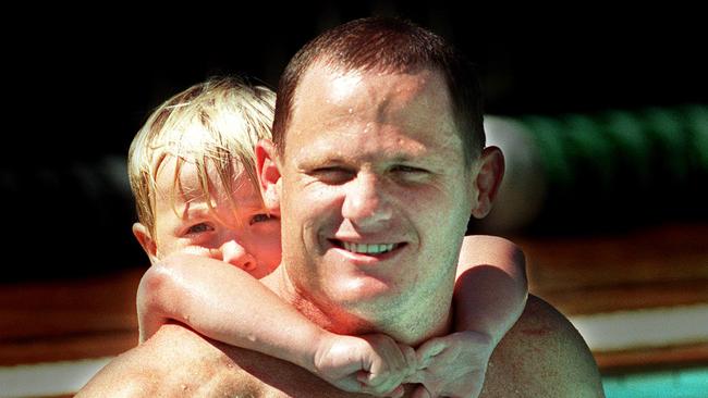 Billy with his dad during a Brisbane Broncos training session at Jindalee.