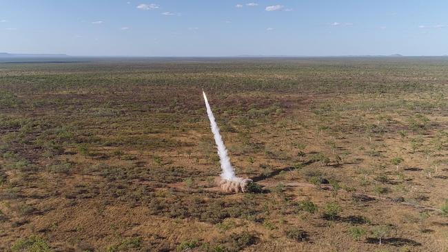 A United States Marine Corps M142 High Mobility Artillery Rocket System (HIMARS) fires a guided rocket against targets on Bradshaw Field Training Area in the Northern Territory.