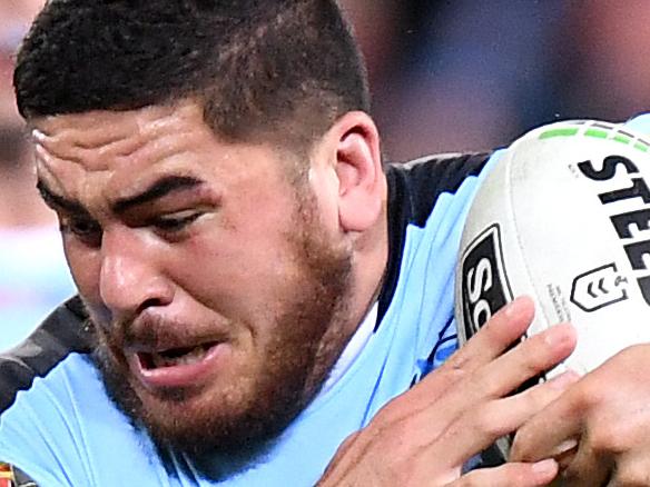 BRISBANE, AUSTRALIA - MAY 09: Braden Uele of the Sharks takes on the defence during the round nine NRL match between the Gold Coast Titans and the Cronulla Sharks at Suncorp Stadium on May 09, 2019 in Brisbane, Australia. (Photo by Bradley Kanaris/Getty Images)