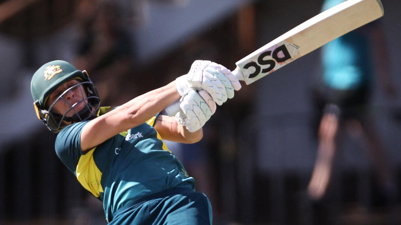 Ashleigh Gardner smashes a six against the West Indies. Picture: David Gray / AFP