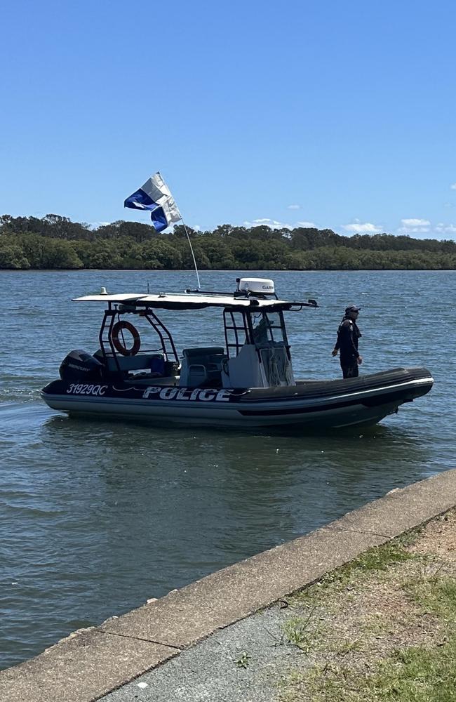 Police divers in the Maroochydore river. Photo: Letea Cavander