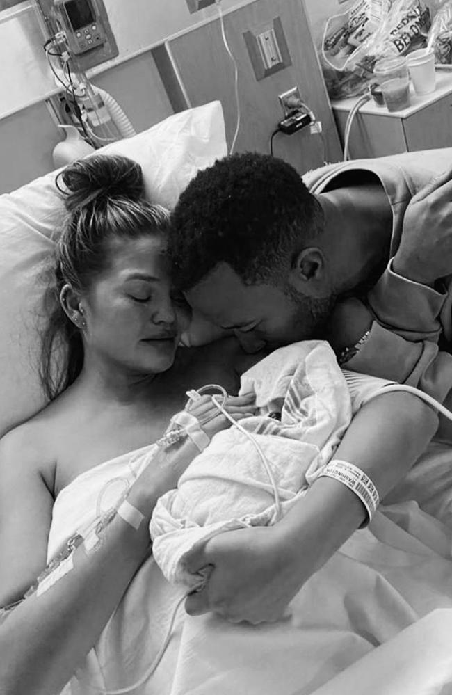 Chrissy Teigen and John Legend holding their stillborn son Jack. Picture: Instagram