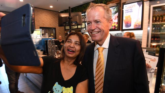 Opposition Leader Bill Shorten has a selfie taken with a supporter during a visit to Westfield North Lakes. Picture: AAP/Dan Peled