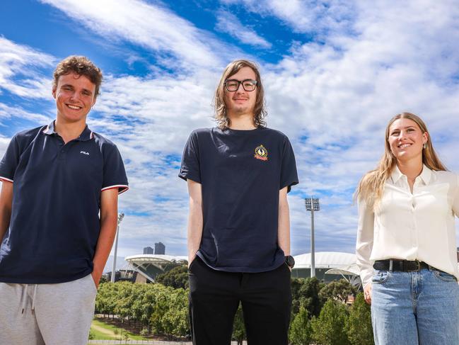 NEWS ADV12 students Lachie Martin 18, Jakob Bogert 17 and Imogen Smith 18 together at the top of Montefiore Hill, looking back over the city. Image/Russell Millard Photography