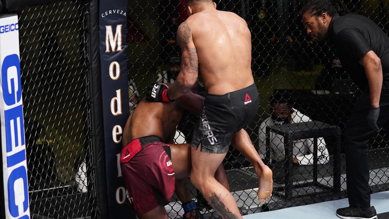 Eryk Anders lands an illegal knee against Darren Stewart of England.