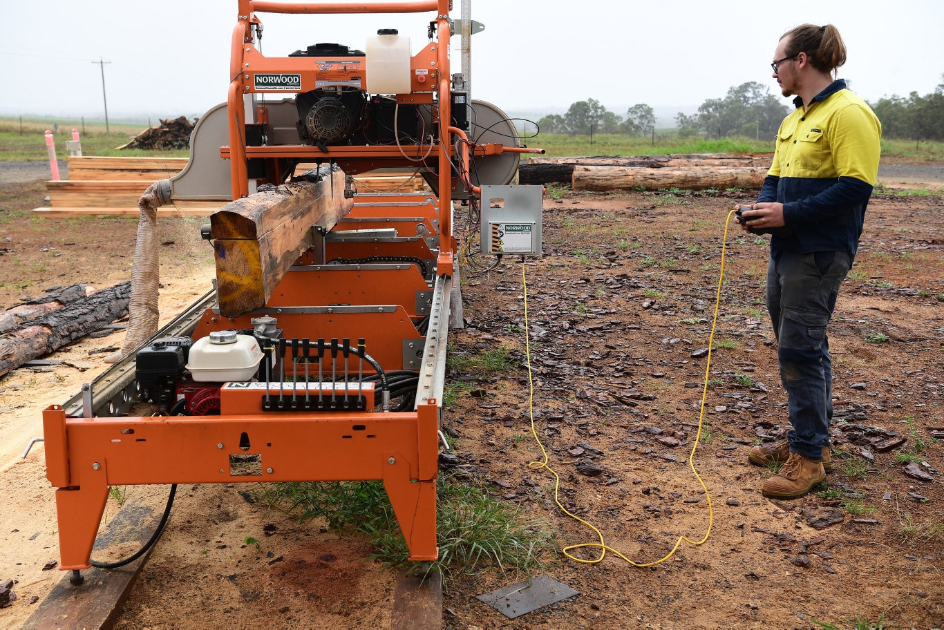 Andrew Robertson removing flitch from the pine core at the Essential Queensland manufacturing plant in Isis Central. Picture: Mike Knott