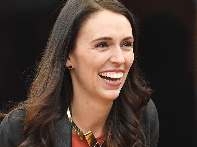 New Zealand's Labour party leader Jacinda Ardern receives applause as she is welcomed to her first caucus meeting as Prime Minister-elect at Parliament in Wellington on October 20, 2017. New Zealand's Prime Minister-elect Jacinda Ardern expressed confidence October 20 that her new government would see out its full term, despite long-standing tensions between her coalition partners. / AFP PHOTO / Marty MELVILLE