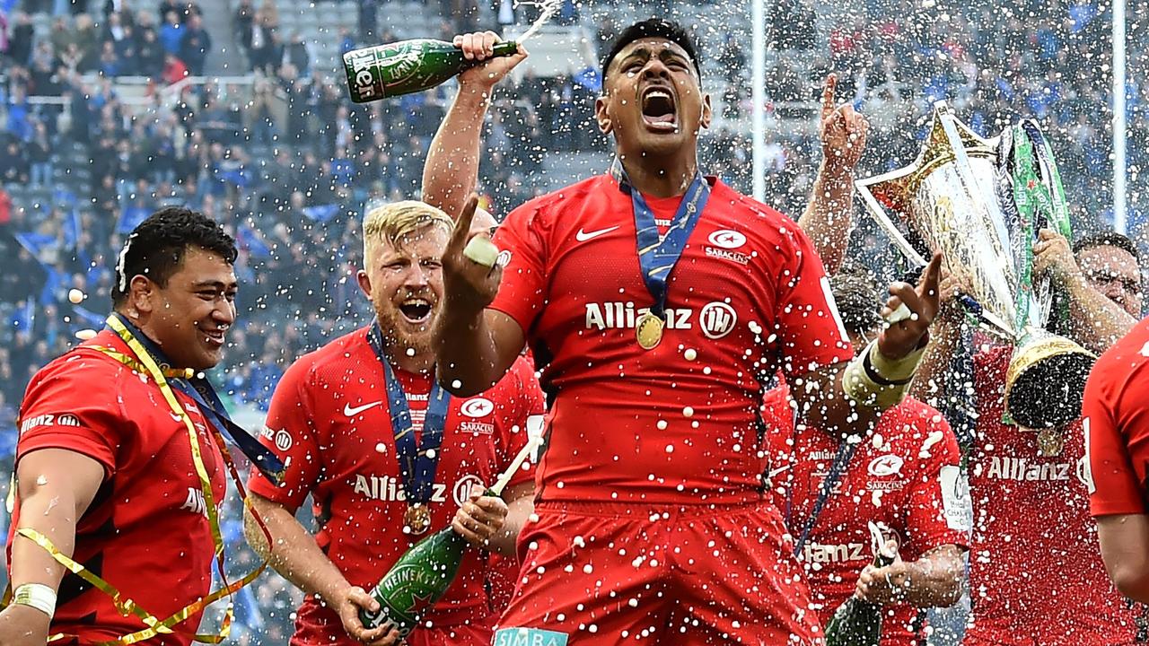 Champagne is sprayed as Saracens lock Will Skelton celebrates their win.