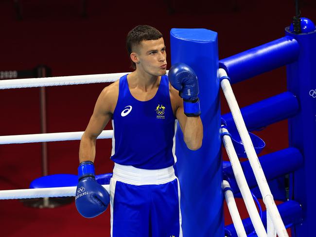 Australia's Harry Garside (in blue) in action against Andy Cruz of Cuba during the semi-final of the mens Light (57kg-63kg) boxing at the Kokugikan Arena at the 2020 Tokyo Olympics. Pics Adam Head