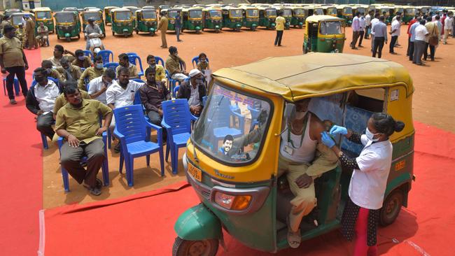 An auto rickshaw driver receives a jab of Covid-19 vaccine in Bangalore, India. Picture: AFP