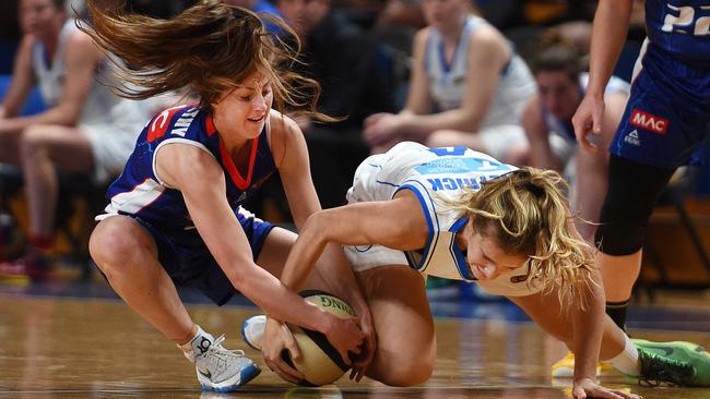 Adelaide Lightning's Sarah Elsworthy and Bendigo Spirit's Blake Dietrick battle for the ball.