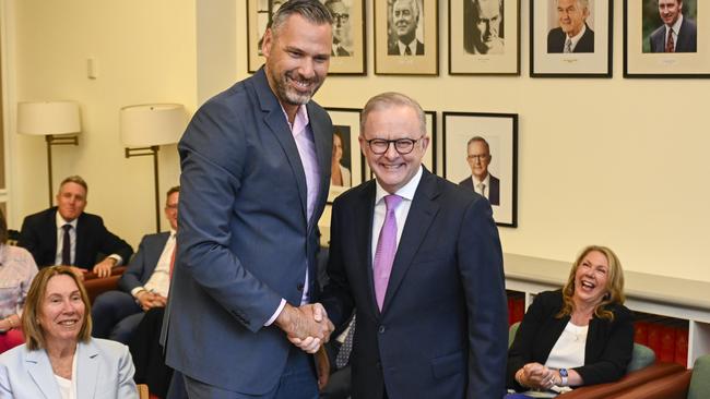 Matt Smith, the newly-elected member for Leichhardt, signs the Caucus membership book with Prime Minister Anthony Albanese at Parliament House in Canberra. Picture: NewsWire / Martin Ollman