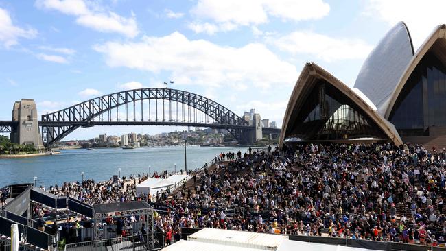 Crowds watch from the Opera House steps at the finish line of the 2024 Sydney Marathon at the Sydney Opera House. Picture: NewsWire / Damian Shaw