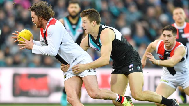 Jack Trengove tackles St Kilda’s Jack Steven during the clubs’ clash at Adelaide Oval last year. Picture: AAP/David Mariuz