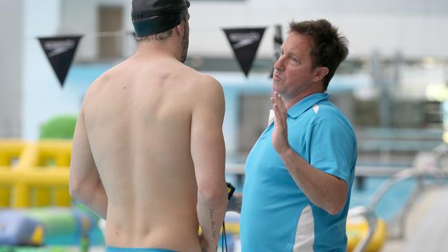 Winning team ... swimming coach Peter Bishop instructs Olympic gold medallist Kyle Chalmers at SA Aquatic and Leisure Centre. Picture: Dean Martin