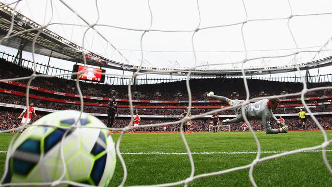 Arsenal forward Alexis Sanchez beats Liverpool goalkeeper to make it 3-0 at the Emirates.