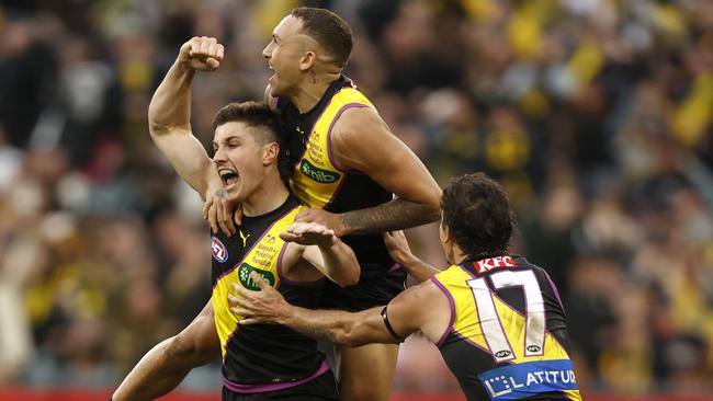 Liam Baker celebrates the matchwinning goal with teammate Shai Bolton and Daniel Rioli. Picture: Darrian Traynor/Getty Images