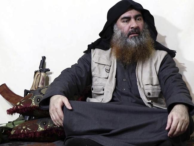 Abu Bakr al-Baghdadi, being interviewed by his group's Al-Furqan media outlet. The world has reacted to the death of the IS leader. Picture: Al-Furqan media via AP