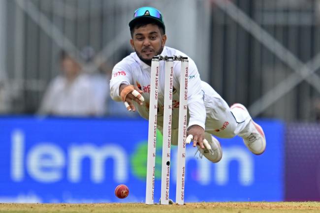 Bangladesh's Zakir Hasan dives during the first day of the first Test cricket match between India and Bangladesh