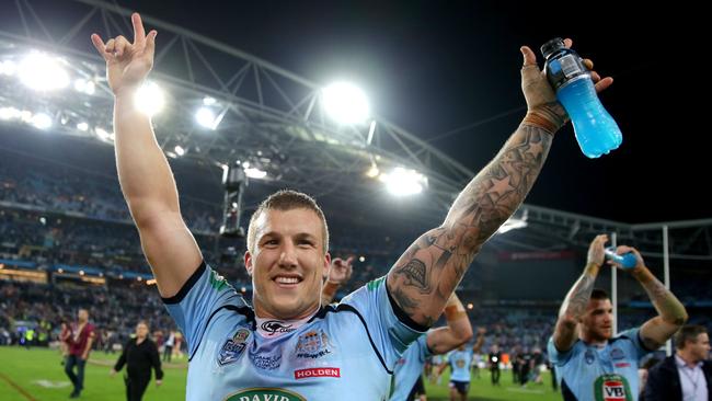 Trent Hodkinson celebrates winning the 2014 State of Origin series. Picture: Gregg Porteous