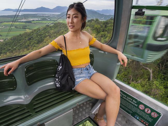 Ex Cairns to The Australian,   05.03.2020Tourism and Coronavirus- PICS by BRIAN CASSEY  Leah Zhao - Canadian tourist from Toronto travelling on her own - is the sole occupant of a gondaler on the SkyRail Rainforest Cableway in Cairns.Pic - Brian Cassey