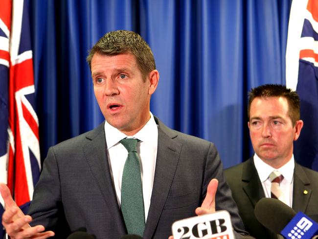 NSW Premier Mike Baird and Local Government Minister Paul Toole released IPART's review of councils, foreshadowing forced mergers. Pic Stephen Cooper