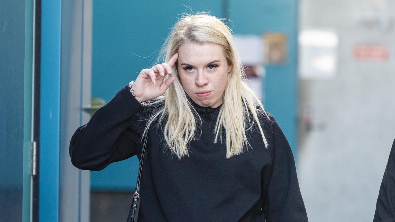 Isobel Rose Higgins, 24, leaves the Toowoomba Watch House after being charged with being an accessory after the fact of murder of Thor Morgan, Thursday, August 18, 2022.