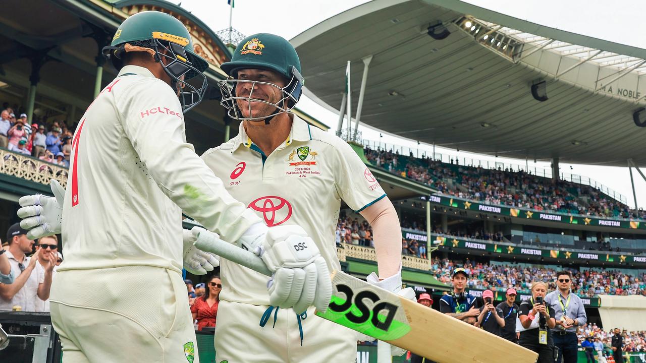 Warner and Khawaja embraced before heading onto the field.